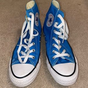 Bright blue high top Converse sneakers